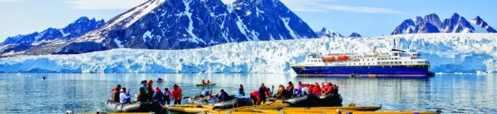 Taking a kayaking trip around Monaco Glacier on Spitsbergen Island.