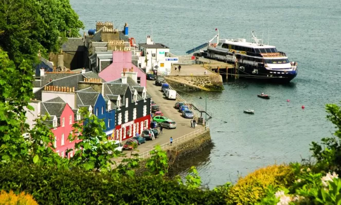 The Lord of the Glens docked at a European village.
