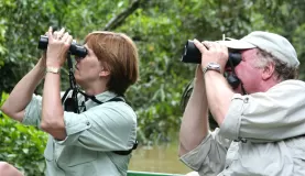 Traveler's looking at local wildlife through binoculars.