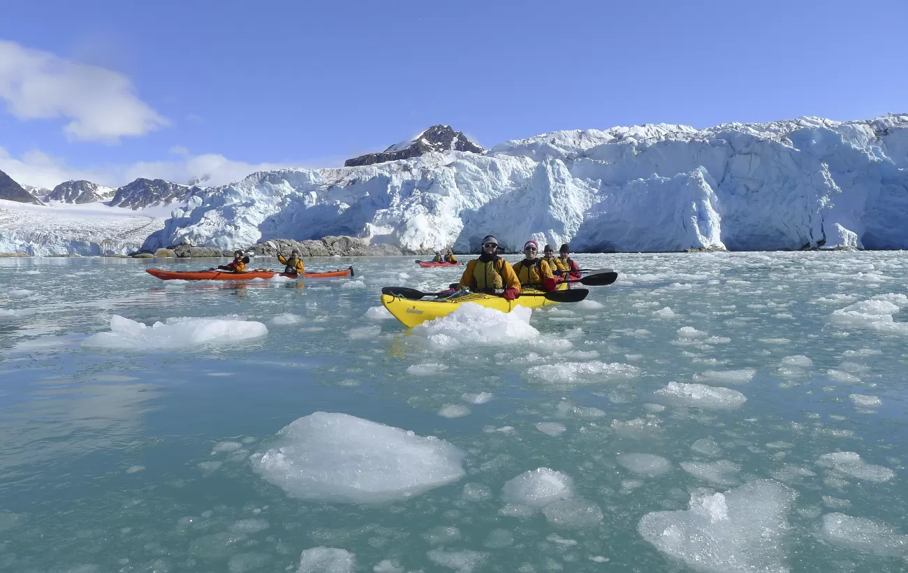 Kayaking through the arctic waters.