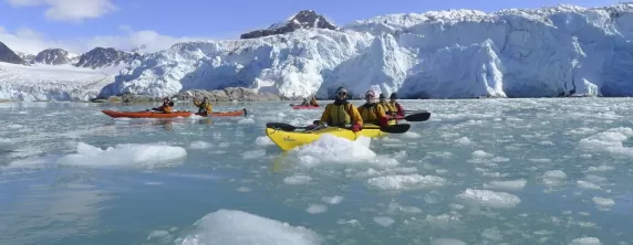 Kayaking through the arctic waters.