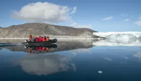 Zodiac tour to see glacier and the arctic landscape.