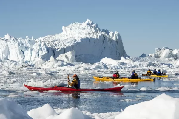 Kayaking through the icy waters.