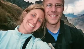 Aaron and Beth smiling on the top of Dead Womans Pass - day 2 of the Inca Trail trek