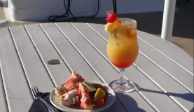 Crab legs and cocktails on deck