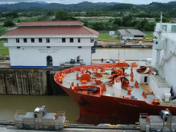 Ship being pulled through the Miraflores Locks of the Panama Canal