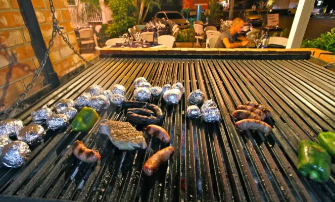 The outdoor grill of the hotel cooks some delicious food.