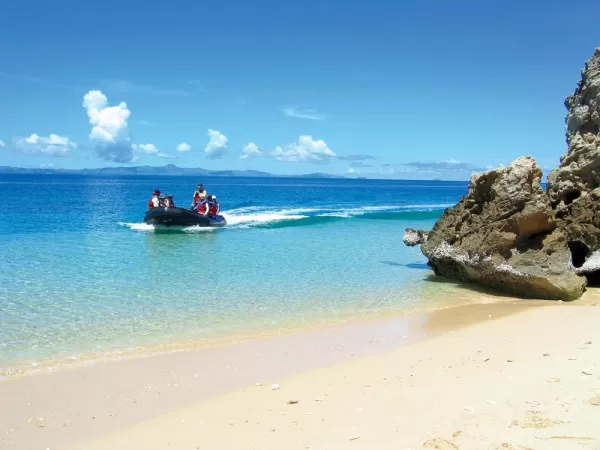 Take a zodiac trip around the island and explore the beautiful white sand beaches.