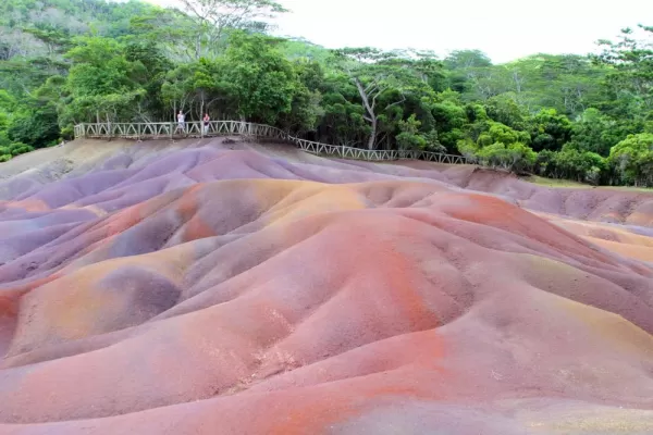 The Seven Coloured Earths is a small region with bright sands due to decomposition of volcanic rock.