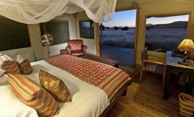 Stay in the spacious and unique rooms at the Desert Rhino Camp