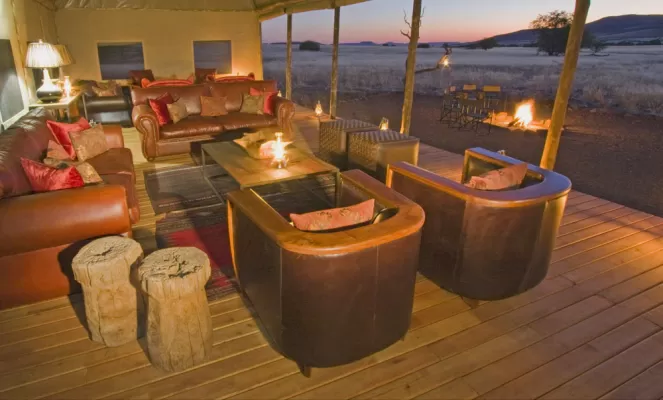 Enjoy the view at sunset from the Desert Rhino Camp's lounge area.