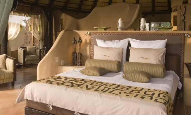 Relax in the spacious and comfortable rooms at Okonjima Bush Camp