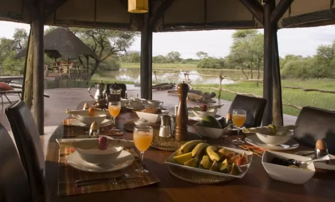 Enjoy a delicious meal while staying at the Okonjima Bush Camp