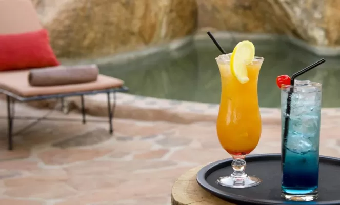 Relax by the pool and enjoy a drink at Camp Kipwe