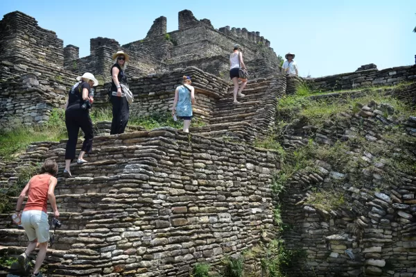 Travelers climb to the top of the Tonina ruins.