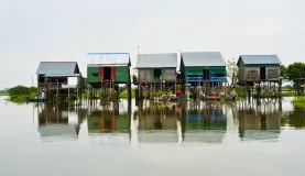 Explore the floating village of Tonle Sap