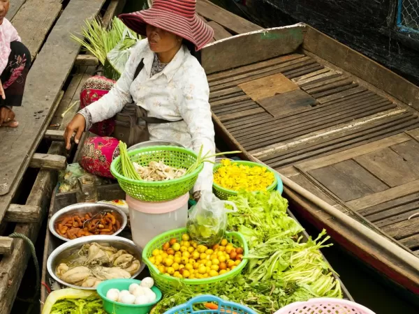 A local sells produce in the floating market