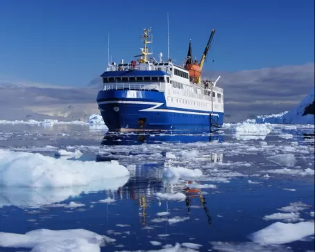 The ice-strengthened Ocean Nova crusies among Arctic icebergs