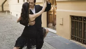 A young couple dances a traditional tango in the streets of Buenos Aires