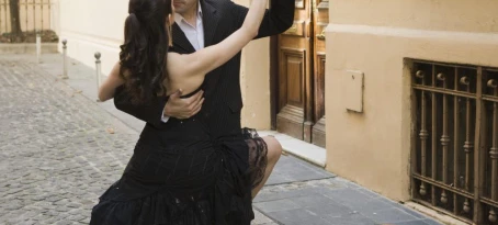 A young couple dances a traditional tango in the streets of Buenos Aires
