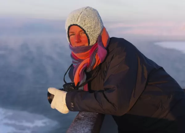 A traveler enjoys a Norwegian sunrise