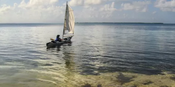 Attach a sail to your kayak for peaceful drifting