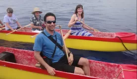 Paddling on an outrigger canoe tour
