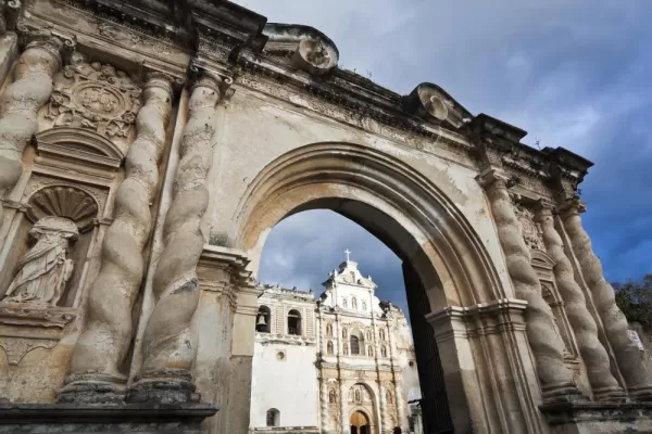 Antigua's cathedral as seen through stone arches