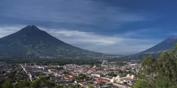 The city of Antigua is nestled between two volcanos