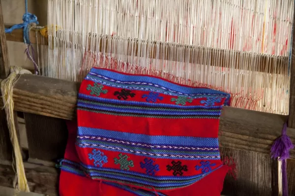 View the process of turning wool into colorful garments