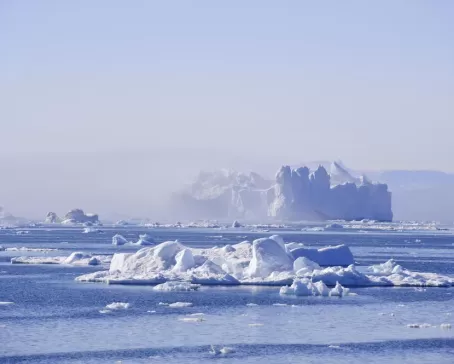 A towering iceberg drifts in Disko Bay