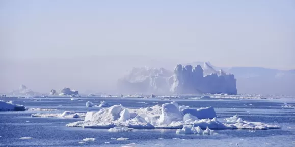 A towering iceberg drifts in Disko Bay