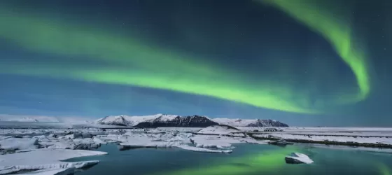 Northern lights dance across the Arctic landscape