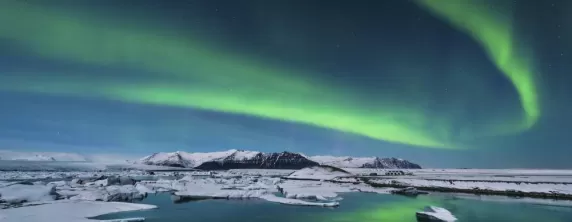 Northern lights dance across the Arctic landscape