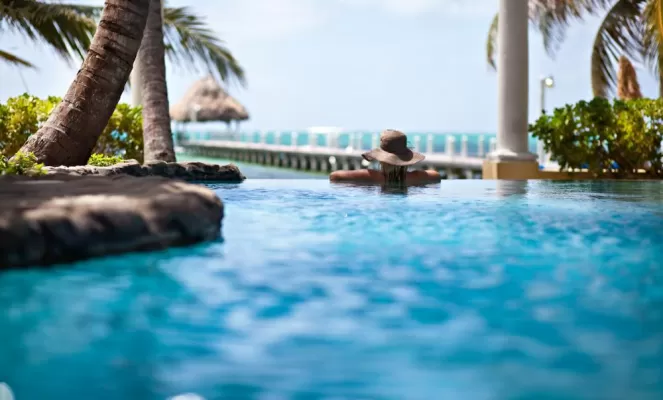 Enjoy views of the beach from the pool at Pelican Reef