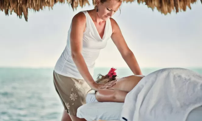 Enjoy a beachside massage during your stay at Pelican Reef