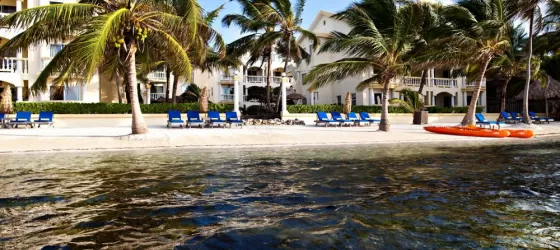 Relax on the large, sunny beach at Pelican Reef Villas