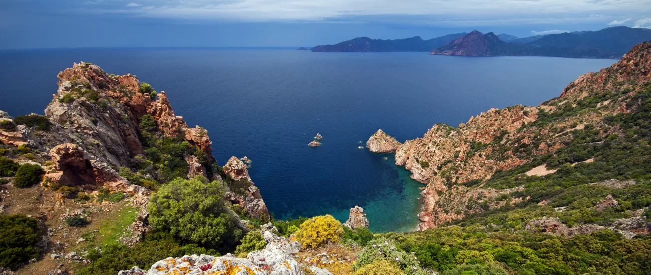 Sail around the crystal waters of Corsica