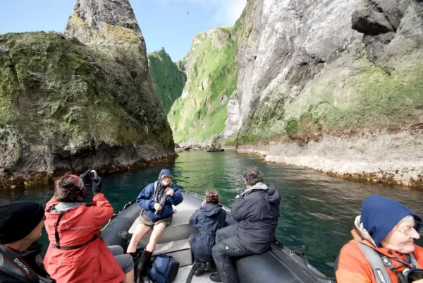 Passengers enter narrow waterways, accessible only by zodiac