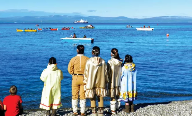 Locals watch the Beringia Baydara Races off the Chukotka peninsula