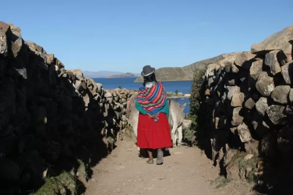 A Peruvian woman near the shore