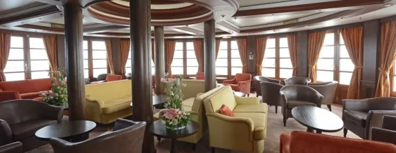 Relax in the lounge on the Caledonian Sky