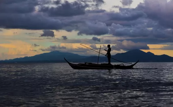 A lone fisherman off the coast of the Philippines