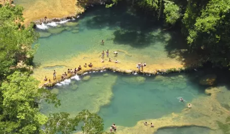 Swim in the crystal pools of Semuc Champey on your Guatemala Tour