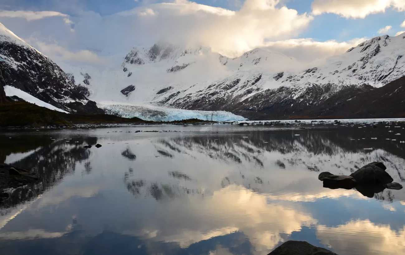 Brookes Glacier sits at the base of large Patagonia mountains