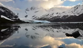Brookes Glacier sits at the base of large Patagonia mountains