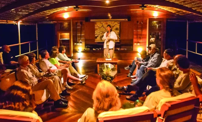 Attend evening programs in the Delfin II's comfortable lounge
