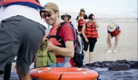 Forrest helps fellow cruisers get into the zodiac