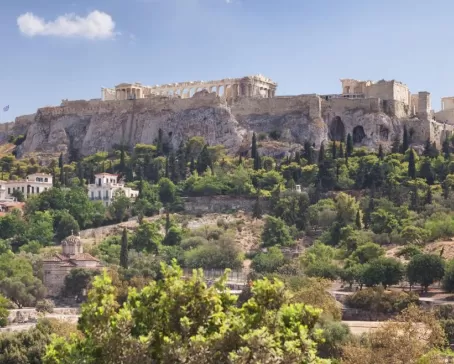 The towering ruins of the Acropolis rise over Athens