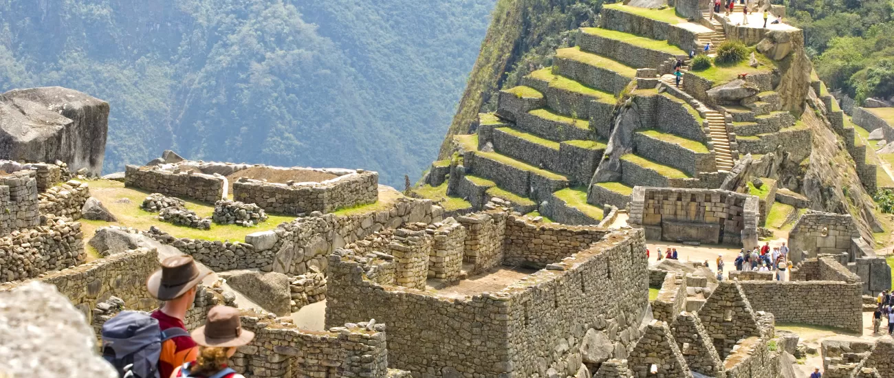 Couple looks out over Machu Picchu